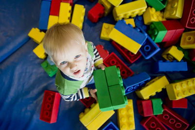 Portrait of cute boy playing with toy blocks