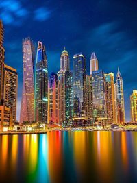 Illuminated buildings in city at night