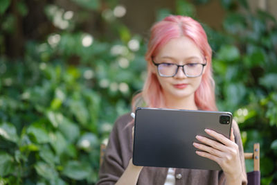 Young woman using digital tablet