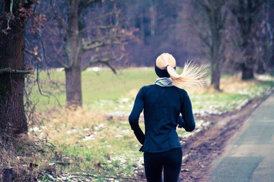 Rear view of woman walking outdoors