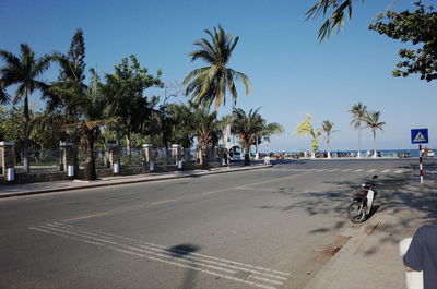 View of people riding bicycle on road