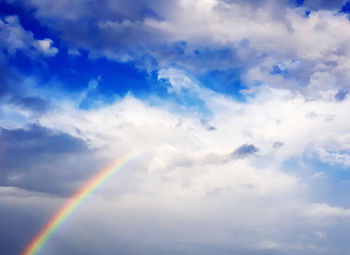 Low angle view of rainbow against sky