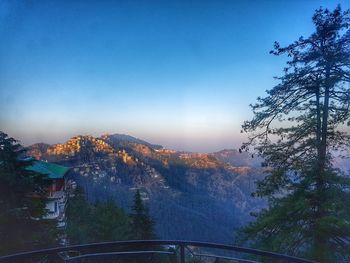 Scenic view of mountains against sky at sunset