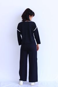 Rear view of woman standing against white background