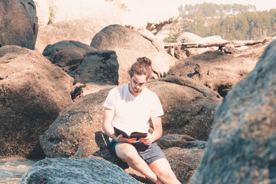 Man sitting on rock