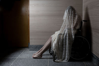 Woman sitting in wheelchair