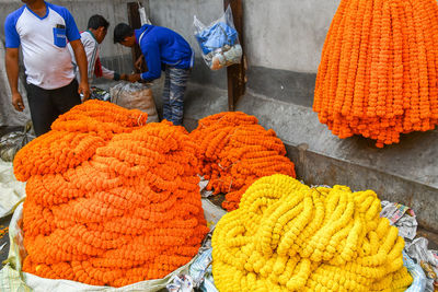 Group of people for sale at market stall