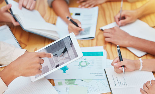 Midsection of business colleagues working at office