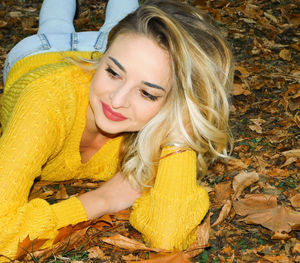 Portrait of a smiling young woman in autumn