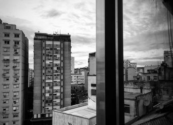 Buildings in city against sky