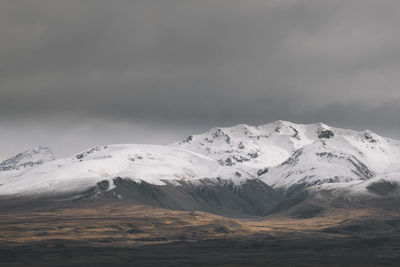 Rugged alpine mountains with snow capped peak south island new zealand