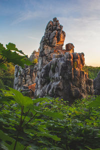 Low angle view of rock formation against sky