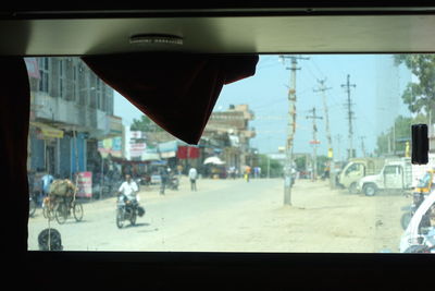 View of city street seen through glass window