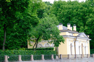 Built structure by trees and plants in park