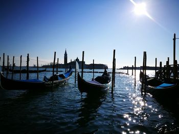 Boats moored in water