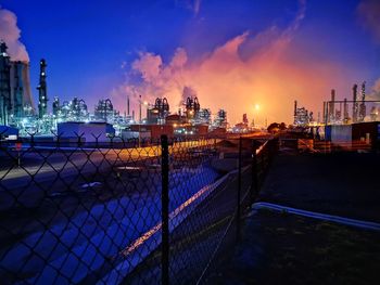 Panoramic view of buildings against sky at night