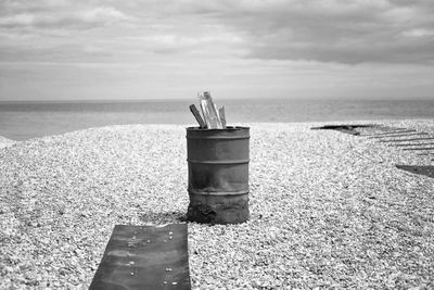 Lifeguard hut on beach against sky