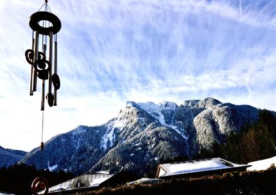 Low angle view of snow on mountain against sky