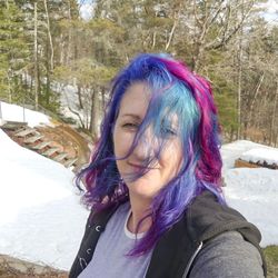 Portrait of smiling woman in snow