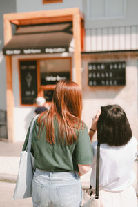 Woman travel with friend and shopping on outdoor shop