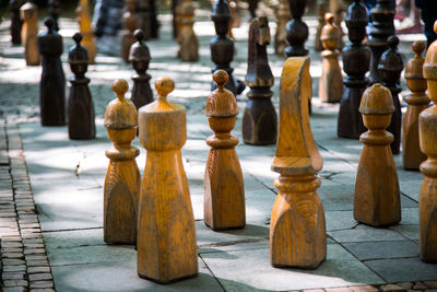 Close-up of chess pieces on footpath