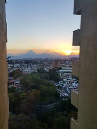 High angle view of buildings against sky during sunset