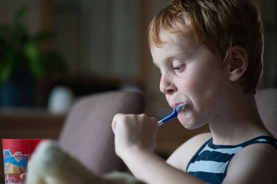 Little boy brushing his teeth