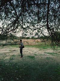 Full length of man standing on field