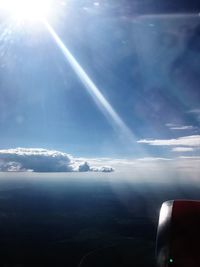 Airplane wing against sky