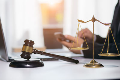 Close-up of clock on table