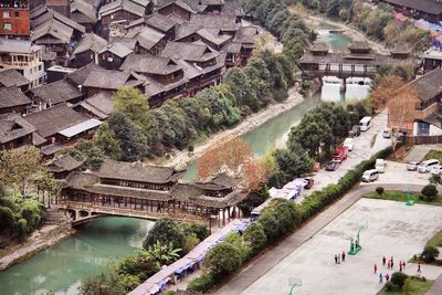 High angle view of canal by houses in china xijiang qianhu miaozhai