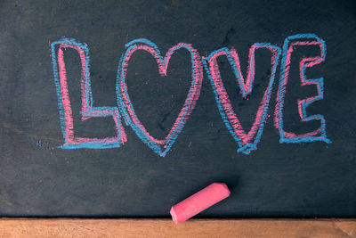 Love and heart shape, handwriting with colored chalk