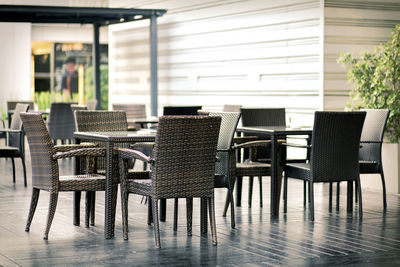 Empty chairs and tables in cafe