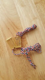 High angle view of strings on wooden table