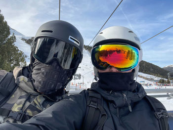 Selfie of the couple wearing ski googles
