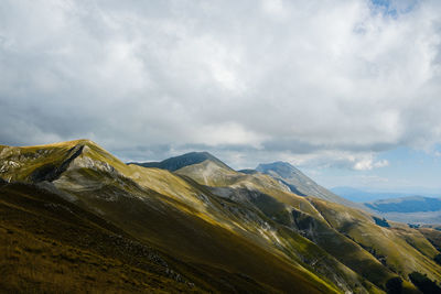 Scenic view of mountains against sky in montemonaco, marche italy