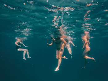 People swimming in sea