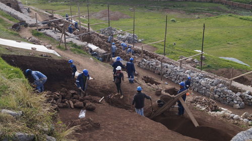 High angle view of people working on field