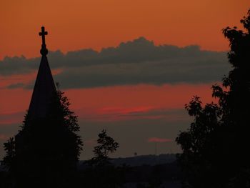 Silhouette temple against sky during sunset