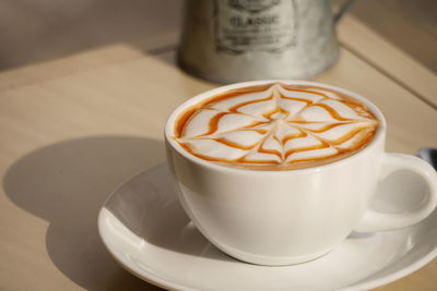 High angle view of cappuccino on table