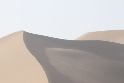 Scenic view of desert against clear sky