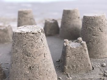 Close-up of sand on beach against sky