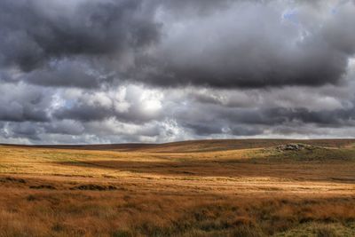 Scenic view of landscape against cloudy sky