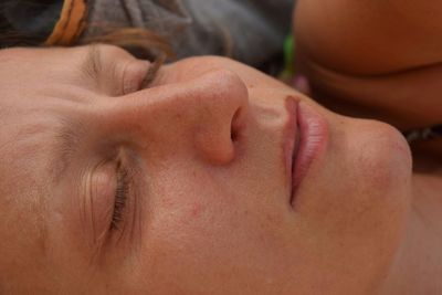 Close-up of woman lying down