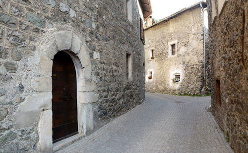 Alley amidst buildings in city