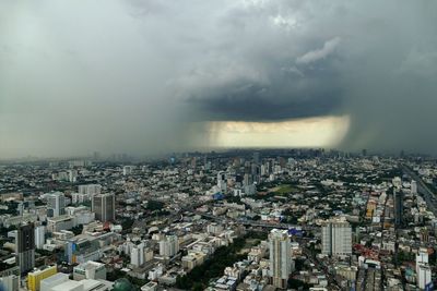 High angle view of city buildings against sky