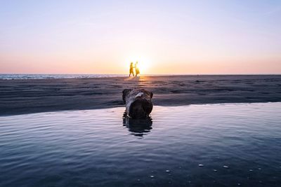 Scenic view of sea at sunset