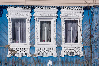Low angle view of blue hanging outside building