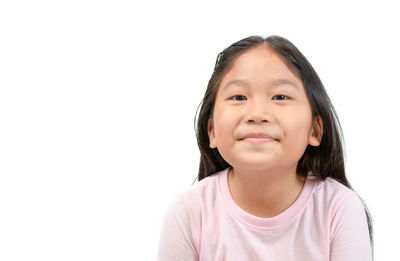 Portrait of cute girl against white background