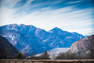 Scenic view of snowcapped mountains against sky